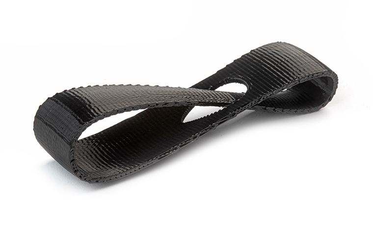 A black 3D-printed loop made from ABS using fused deposition modeling with a normal finish.