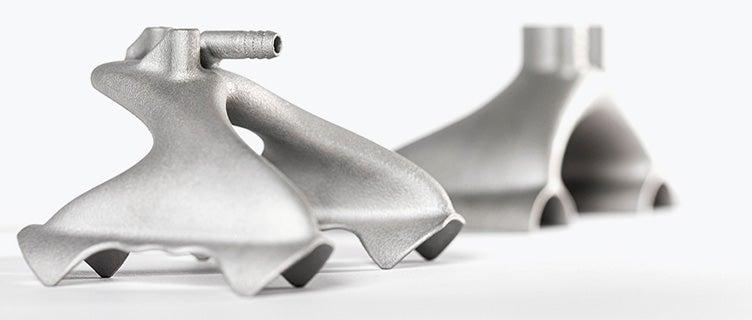Two 3D-printed metal grippers with a design optimized for 3D printing