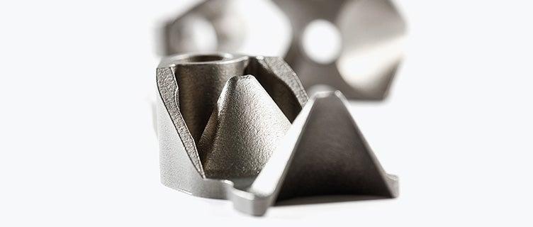 Close-up view of a 3D-printed bracket used in production by Philips