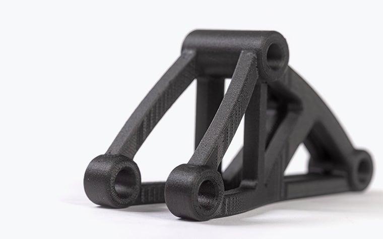 Black 3D-printed bracket in PA-CF