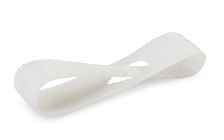 A white 3D-printed loop made from ABSi using fused deposition modeling, with a normal finish. 