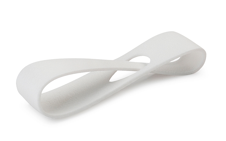 A white 3D-printed loop made from sustainable Bluesint PA 12 using laser sintering, with a normal finish. 