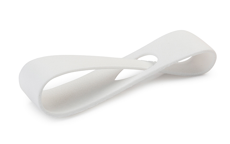 A white 3D-printed loop made from PA 12 using laser sintering, finished with a fuel resistant sealant.