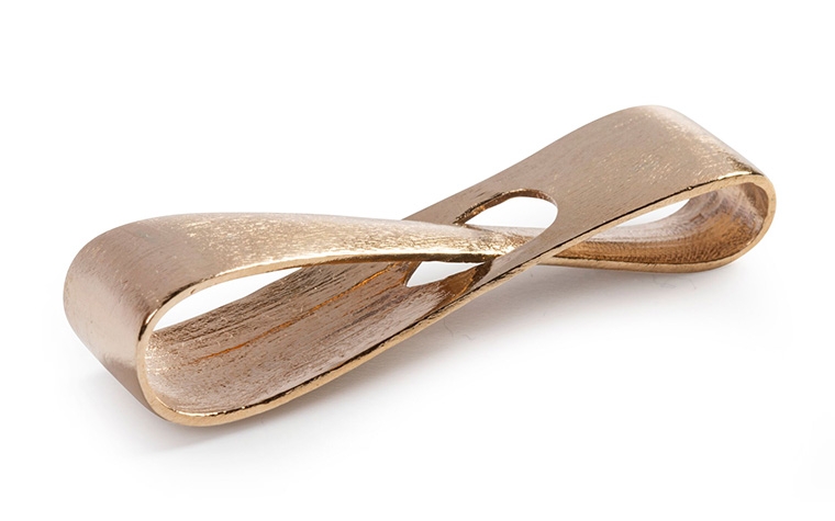 A bronze infinity loop made with lost-wax casting and an unpolished + PU coated finish.
