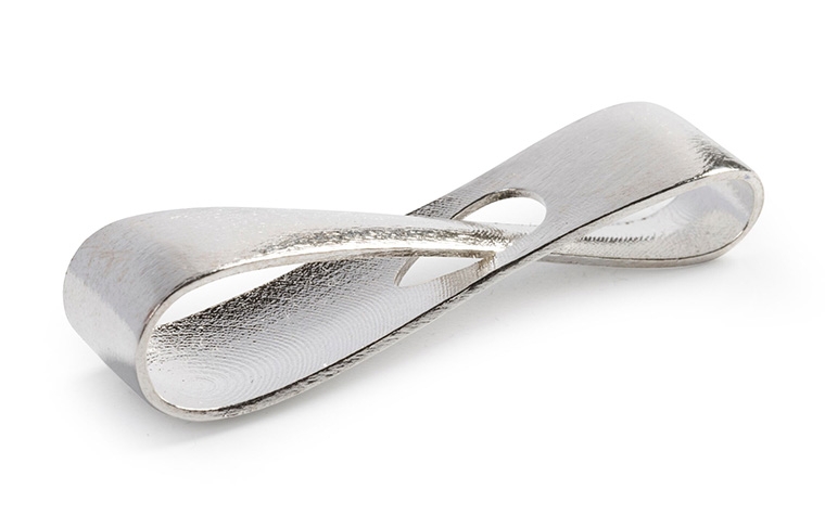 A silver infinity loop made with lost-wax casting and a polished finish.
